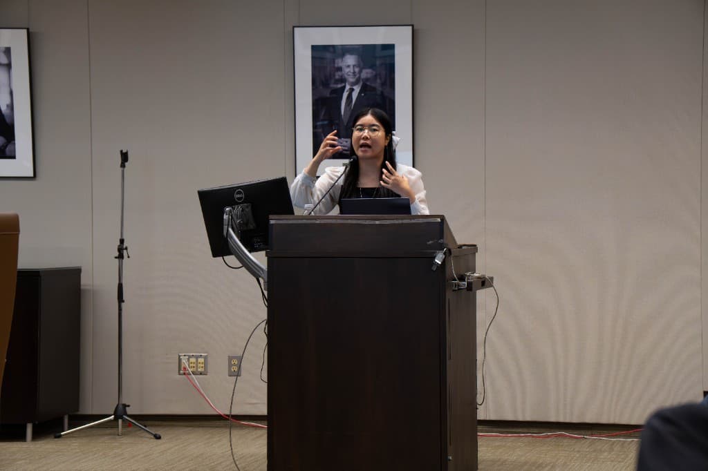 Lucille Yi speaking at the podium during Learn to Network